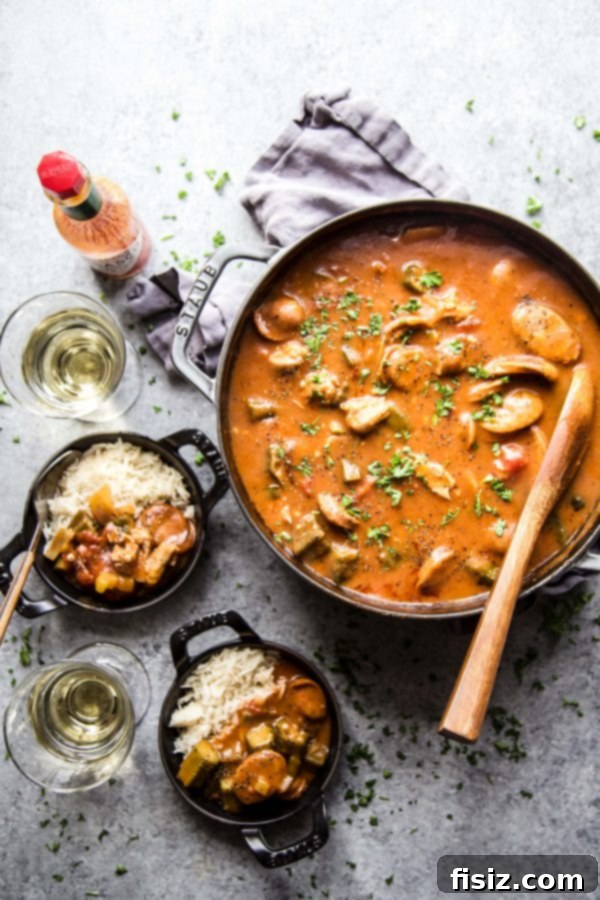 Chicken and Chorizo Gumbo: A Southern Classic 6 Close-up of a bowl of Chicken and Chorizo Gumbo with a spoon, steam rising.
