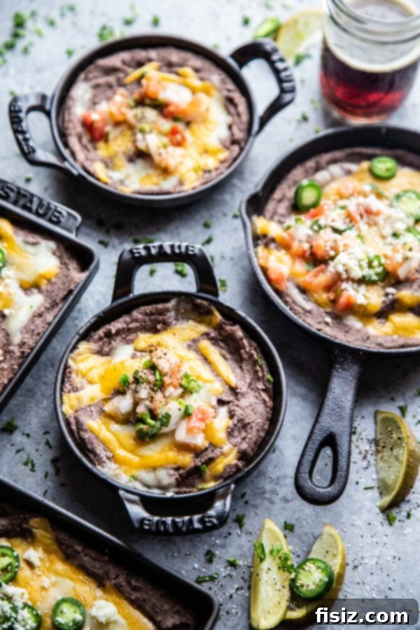The Perfect Black Bean Dip 6 skillets on a table