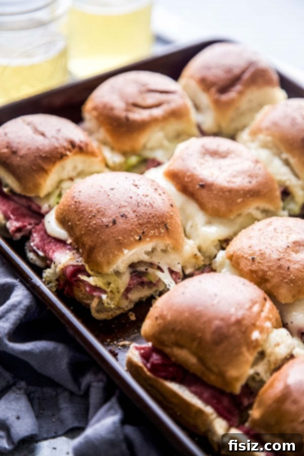 One-Pan Wonder Corned Beef Sliders 2 Close-up of golden brown Sheet Pan Corned Beef Sliders ready to be served.