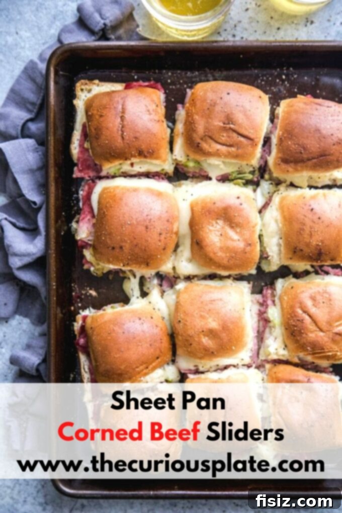 One-Pan Wonder Corned Beef Sliders 9 Another enticing shot of Sheet Pan Corned Beef Sliders on a wooden cutting board, ready to serve.
