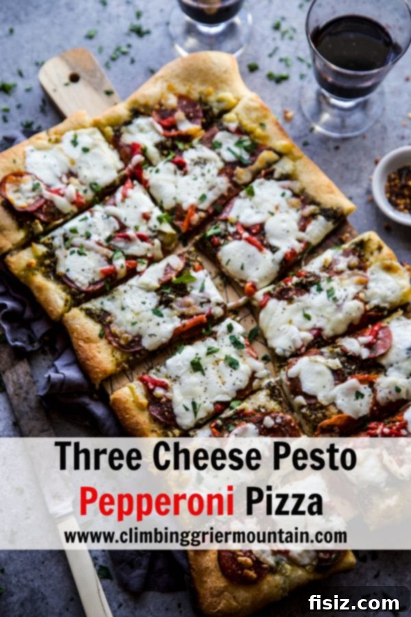 Ultimate Pesto Pepperoni Three Cheese Pizza 9 A delicious slice of Three Cheese Pesto Pepperoni Pizza, highlighting its perfect crust and topping distribution.