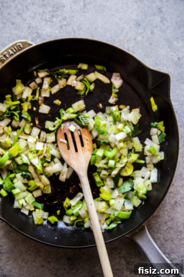 Green Shakshuka with Feta, Spinach, and Peas 4 Sautéing chopped leek and onion in a large skillet