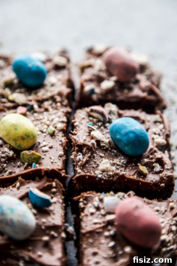 Fudgy Easter Brownies with Decadent Chocolate Cream Cheese Frosting 5 A vibrant display of Chocolate Easter Brownies with Cream Cheese Frosting, beautifully garnished with Easter eggs.