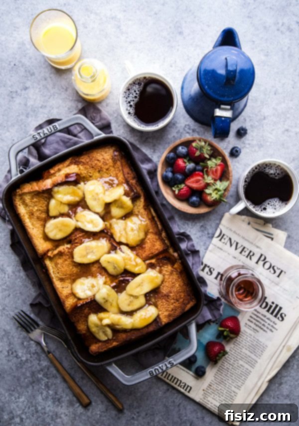 Baked French Toast with Nut Butter and Bananas 6 A perfectly portioned slice of Nut Butter-Banana Stuffed French Toast Bake, topped with fresh bananas and a drizzle of syrup