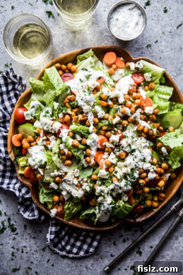 Zesty Chickpea Crunch 2 Large bowl of vibrant Buffalo Chickpea Salad with fresh vegetables and creamy dressing