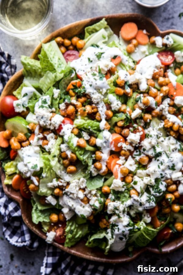 Zesty Chickpea Crunch 3 Appetizing close-up of Buffalo Chickpea Salad with visible chickpeas and crisp romaine