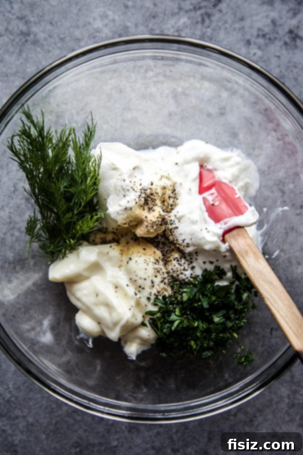 Zesty Chickpea Crunch 5 Smooth and creamy Greek yogurt dressing in a small bowl, perfect for salad