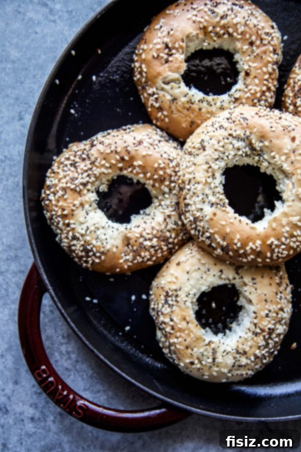 Fresh everything bagels arranged in a baking dish, ready for preparation