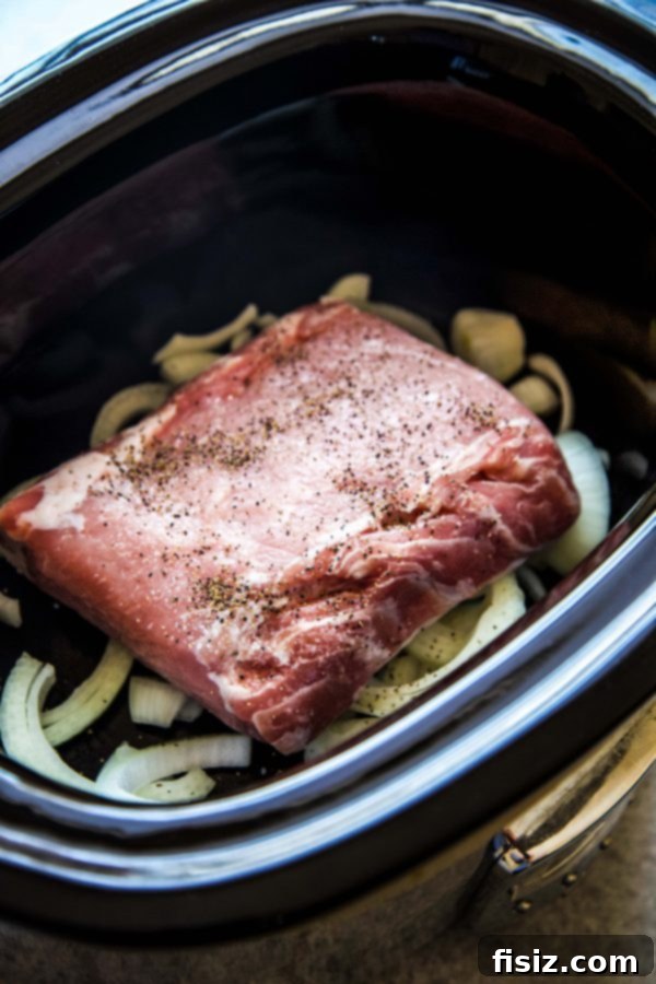 Authentic Slow Cooker Cuban Pulled Pork 4 boneless pork shoulder roast in a slow cooker