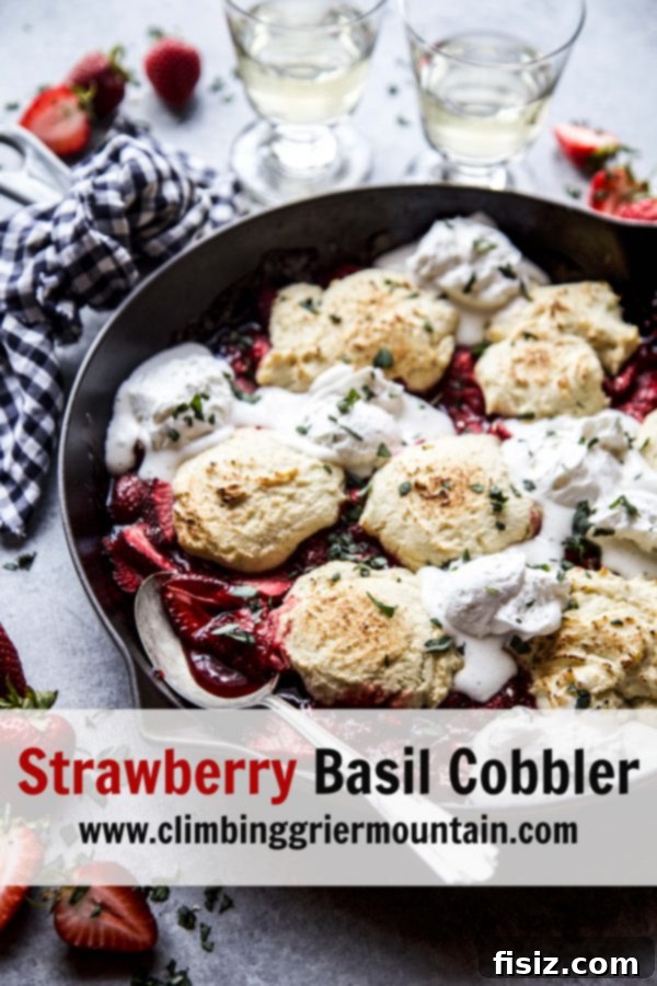 Close up of a slice of Strawberry Basil Cobbler with a scoop of ice cream