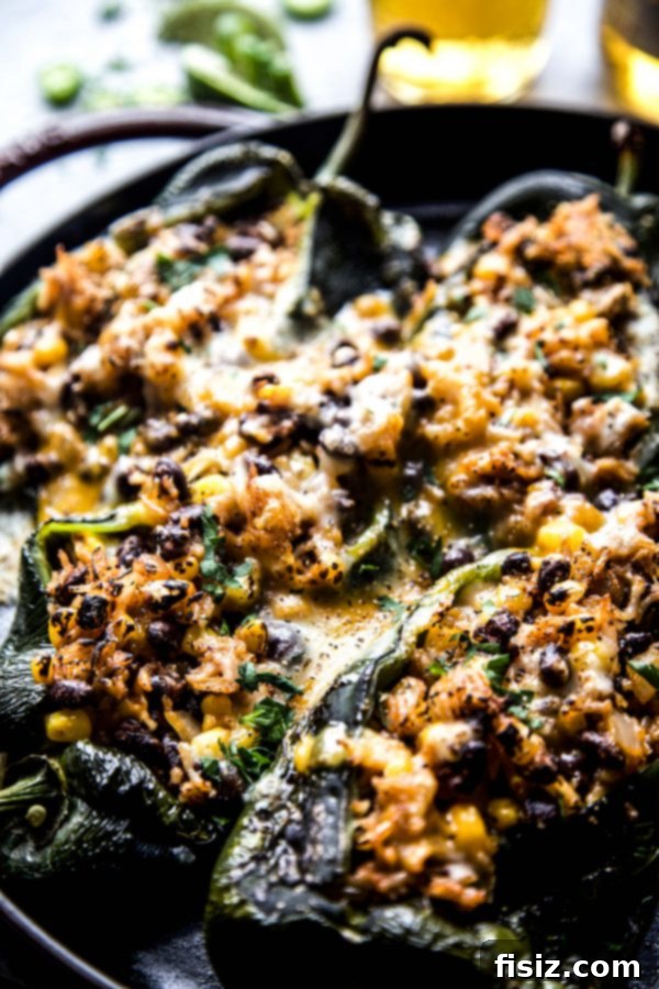 Effortless Chiles Rellenos 6 Close-up of a perfectly baked and stuffed poblano chile, golden and bubbly with melted cheese.