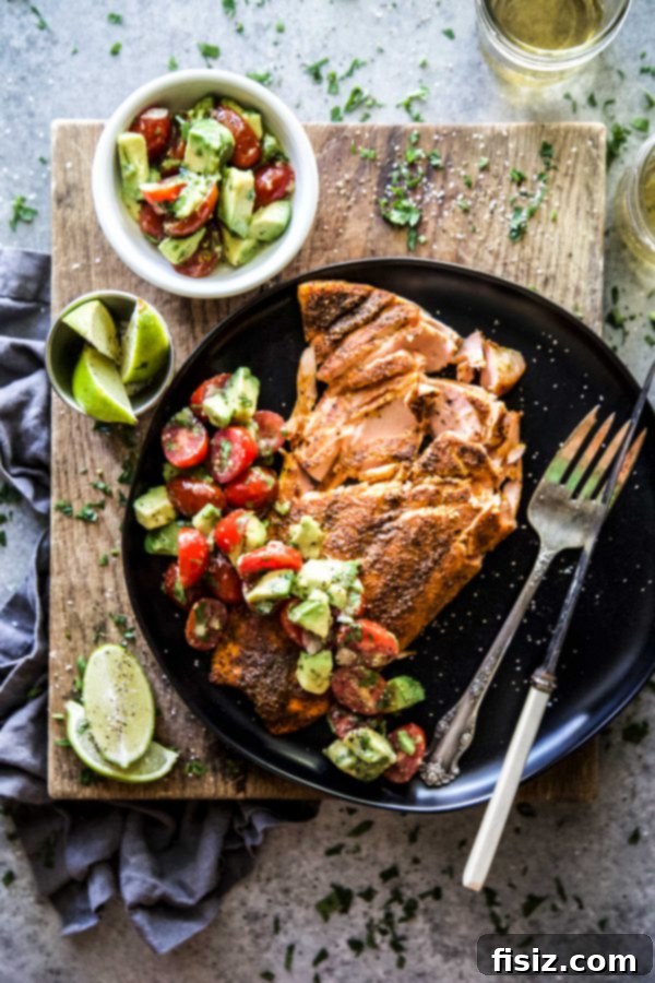 May's Creative Kickoff 8 Mumbai Baked Salmon with a fresh Avocado Salsa, a healthy and flavorful meal.