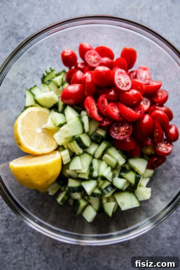 Bright Mediterranean Chicken Thighs with Lemon Cucumber Relish 4 Fresh grape tomatoes, crisp cucumbers, and bright lemons in a bowl, ready for relish.