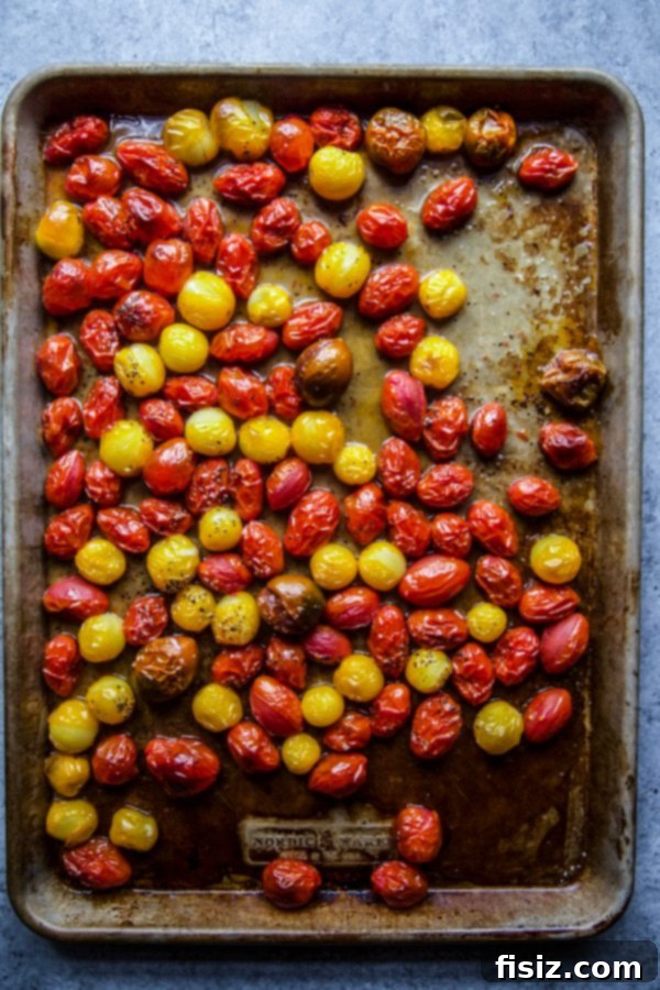 Warm Burrata, Roasted Tomato, and Rustic Bread Medley 4 Oven-roasted grape tomatoes on a baking sheet, glistening with olive oil and seasoning