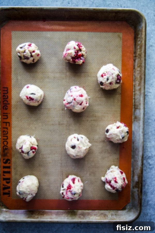 Dark Chocolate Raspberry Bliss Cookies 4 Ingredients for Dark Chocolate Raspberry Drop Cookies laid out on a counter, emphasizing room temperature butter and eggs.