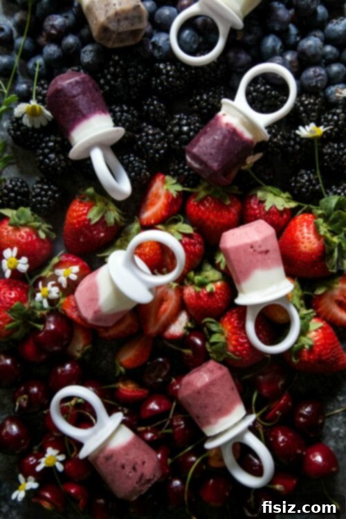 Patriotic yogurt smoothie ring pops for a festive Fourth of July treat.