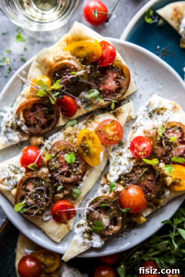 Zaatar Tomato Chickpea Flatbread 7 Beautifully arranged Za'atar Spiced Tomatoes and Chickpea Flatbread, ready to serve
