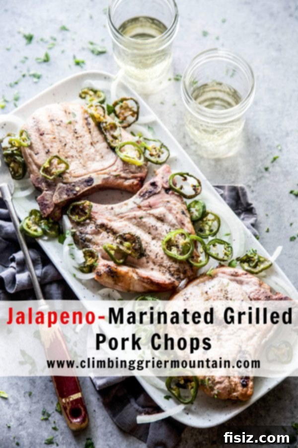 Jalapeno Infused Grilled Pork Chops 9 A final close-up of the delicious Jalapeno-Marinated Grilled Pork Chops, garnished and ready to be enjoyed.