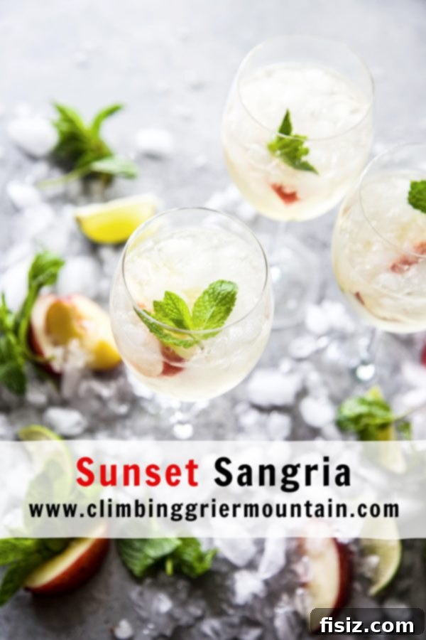 Golden Hour Sangria 8 Beautifully arranged glasses of Sunset Sangria with fruit and mint, ready for a party