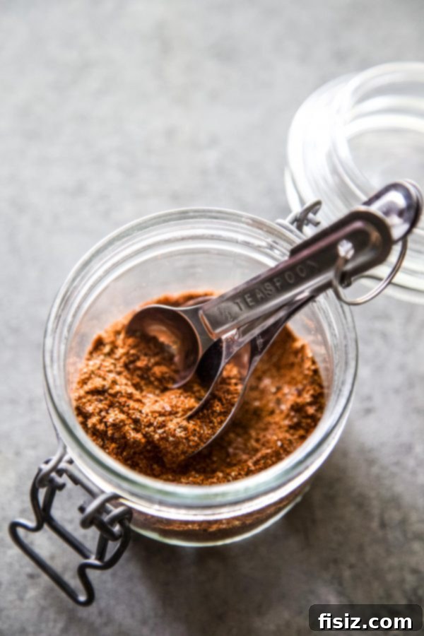 Western Turkey Burrito Bake 5 A jar filled with a vibrant homemade Mexican spice blend, ready for use