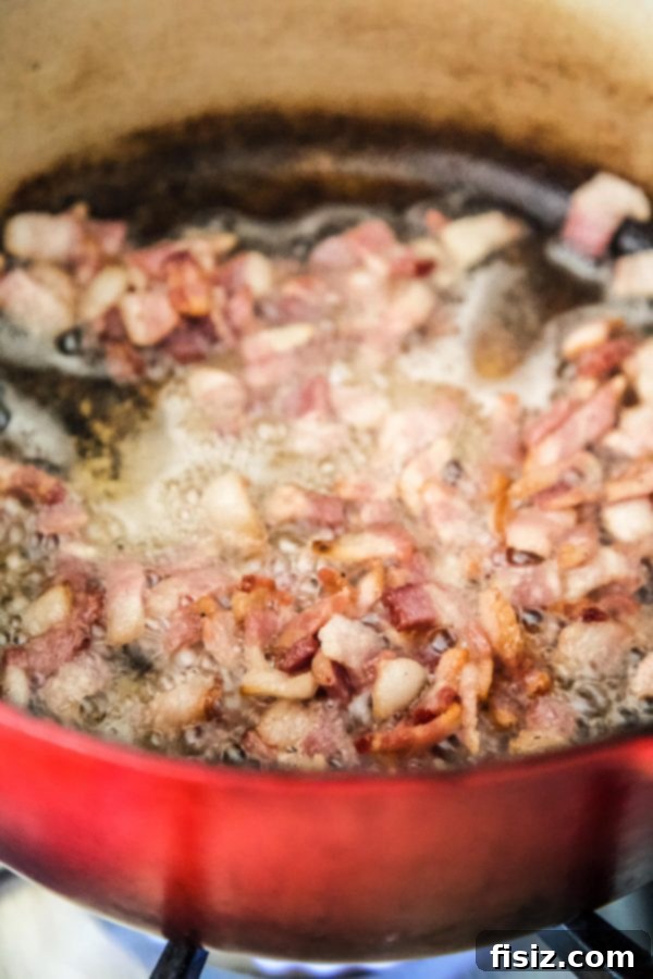 Savory Melon Crunch 4 Crispy bacon sizzling in a hot skillet, ready to be transformed into a delicious crumble.
