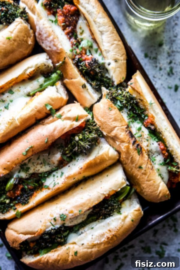 Cheesy Broccolini Sandwiches Made Easy 3 Two Easy Broccolini Cheesesteaks on a serving plate, highlighting the perfectly melted cheese and generous filling.