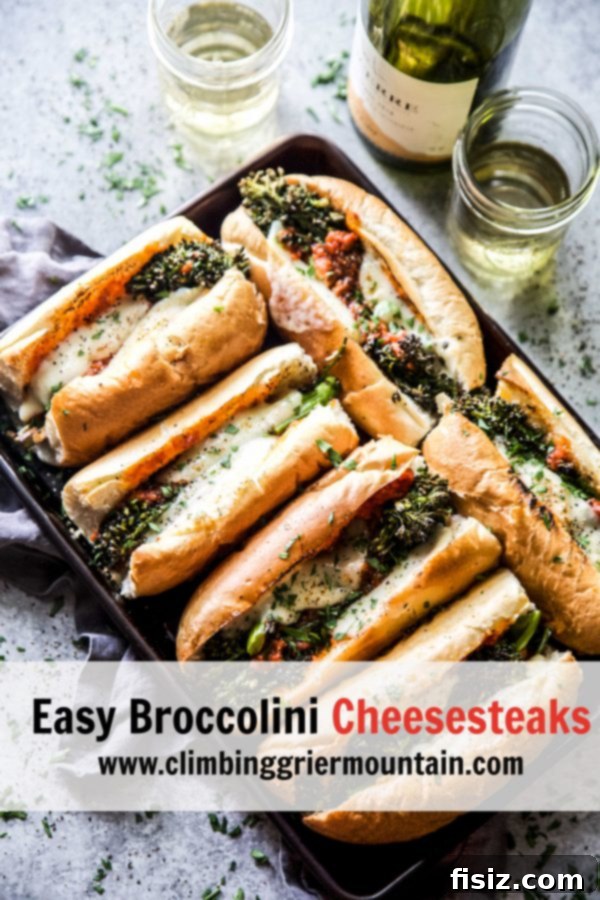 Cheesy Broccolini Sandwiches Made Easy 8 A vibrant, delicious Easy Broccolini Cheesesteak sandwich on a rustic wooden board, ready to be enjoyed.