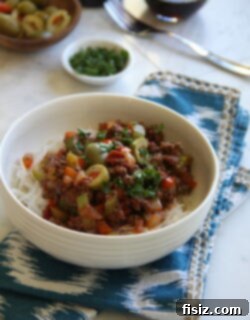 Braised Beef with Pimiento Olives, Red Peppers, and Rice Noodles Recipe Image