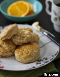 Glazed Orange Biscuits 2 A freshly baked orange biscuit on a plate, ready to be eaten
