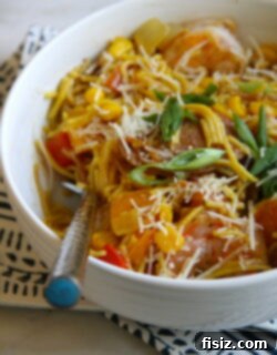 A finished bowl of Fideuà, garnished and ready to eat
