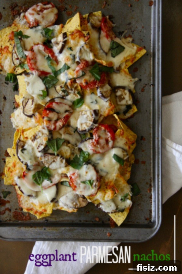Smoky Eggplant Parmesan Nachos 2 Delicious grilled eggplant parmesan nachos piled high with cheese and basil