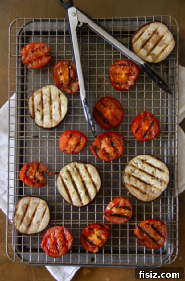 Smoky Eggplant Parmesan Nachos 4 Close-up of golden brown grilled eggplant slices