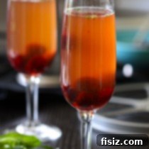 Gatsby's Sparkling Ginger Punch 3 A Great Gatsby cocktail with ginger ale and cognac, garnished with mint and cherries.