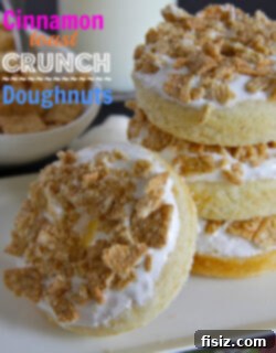 A plate of freshly baked Cinnamon Toast Crunch Doughnuts with meringue.