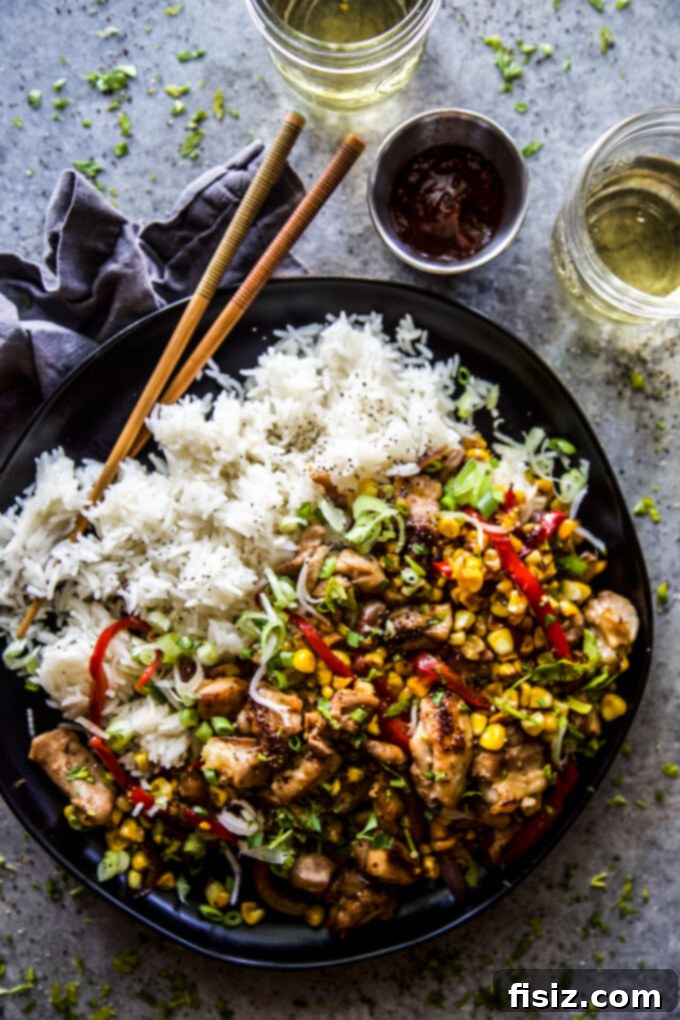 Speedy and Savory Chicken Corn Stir-Fry 2 Delicious Easy Chicken & Corn Stir-Fry in a wok, ready to serve over rice