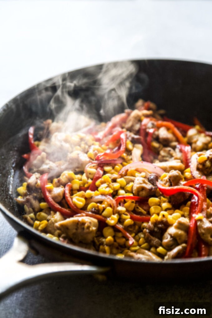 Speedy and Savory Chicken Corn Stir-Fry 5 Easy Chicken & Corn Stir-Fry sizzling in a large skillet with aromatic vegetables