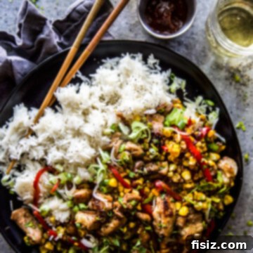 Speedy and Savory Chicken Corn Stir-Fry 8 Easy Chicken & Corn Stir-Fry, top-down view in a bowl with chopsticks