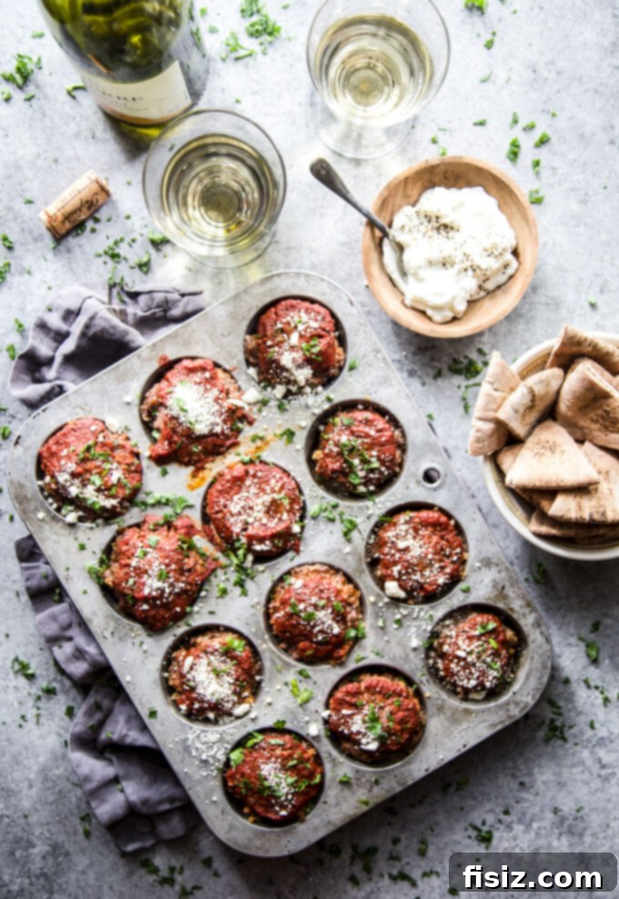 Spiced Beef & Feta Meatloaf Muffins 6 Delicious Spiced Beef Meatloaf Muffins with Feta ready for serving alongside a simple side dish.