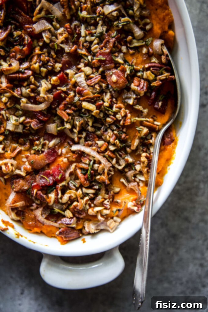 Herbed Sweet Potato Casserole 7 A beautifully presented Savory Sweet Potato Casserole, ready to be served, highlighting its rich texture and savory topping.