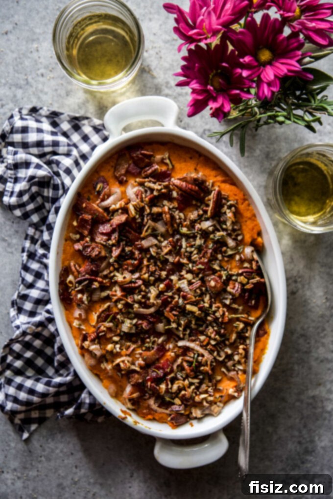Herbed Sweet Potato Casserole 8 A generous serving of Savory Sweet Potato Casserole, showcasing its rich, creamy texture and crispy, flavorful topping.