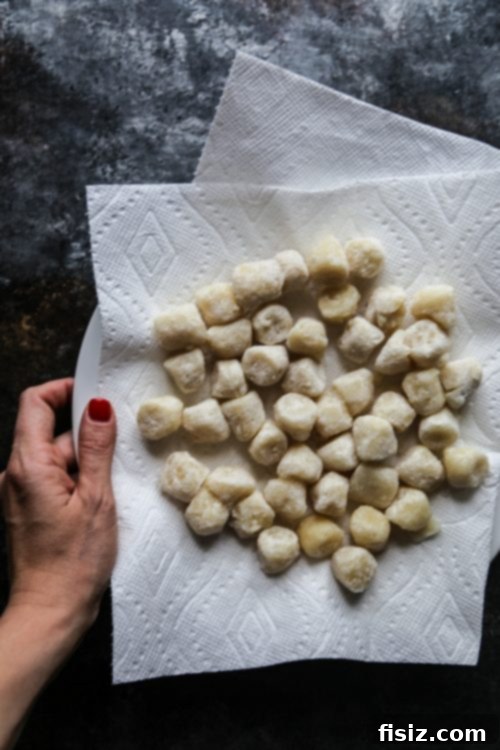 Golden Cauliflower Gnocchi with Creamy Cacio e Pepe and Perfectly Crispy Prosciutto 5 cauliflower gnocchi frozen on a plate