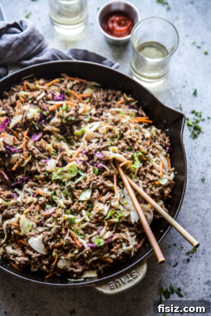 Easy One-Pan Egg Roll Skillet 6 Unstuffed Egg Roll Skillet served in a bowl, garnished with green onions