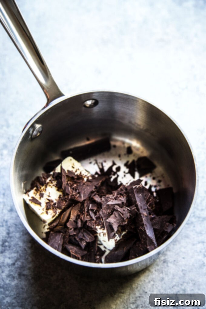 Close-up of chocolate and butter melting in a saucepan for the brownie base