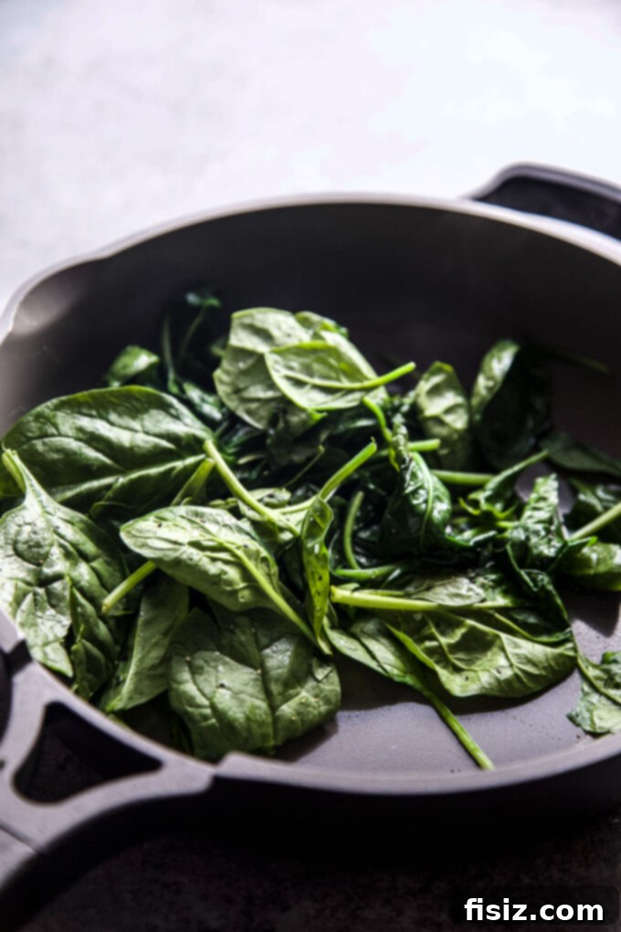 Minty Spinach Yogurt Dip 4 fresh spinach cooking in a skillet