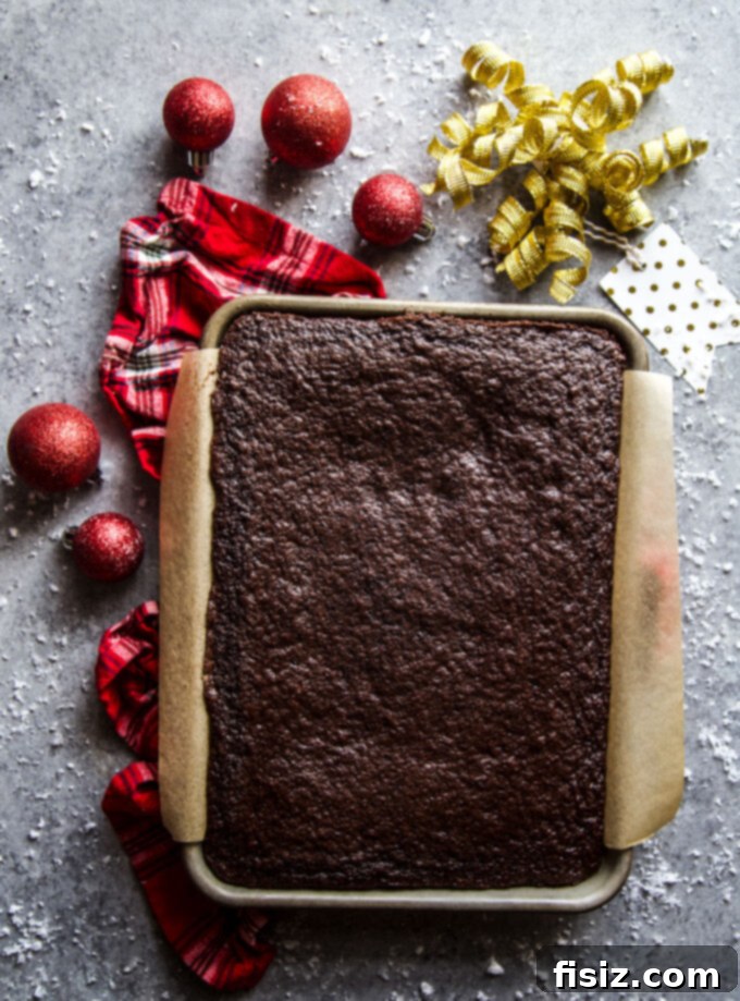 Ugly Sweater Chocolate Cake Extravaganza 4 A baked chocolate sheet cake on a baking sheet, waiting to be frosted.