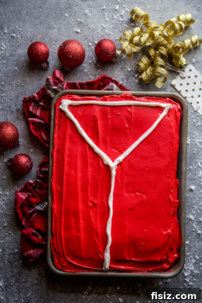 Ugly Sweater Chocolate Cake Extravaganza 6 Chocolate sheet cake frosted with red icing, with a white vanilla frosting outline of a sweater piped on top.