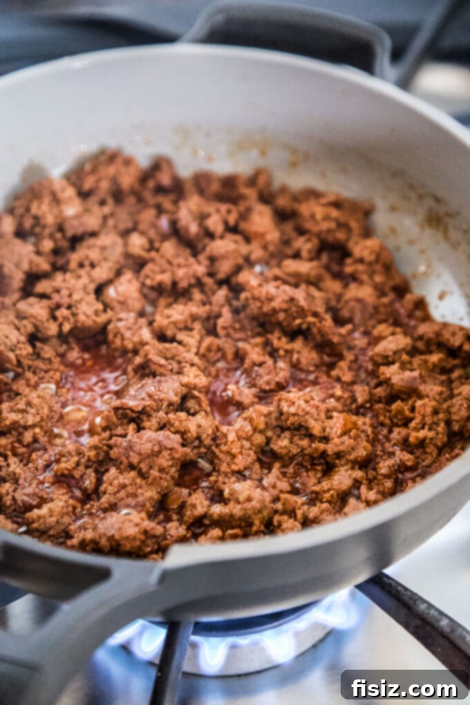 Tex-Mex Egg Bake 4 Ground chorizo cooking in a skillet