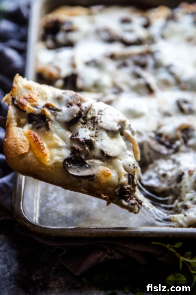 Creamy Burrata Mushroom Sheet Pan Pizza 6 A freshly baked Sheet Pan Mushroom & Burrata Pizza, golden brown and ready to slice.