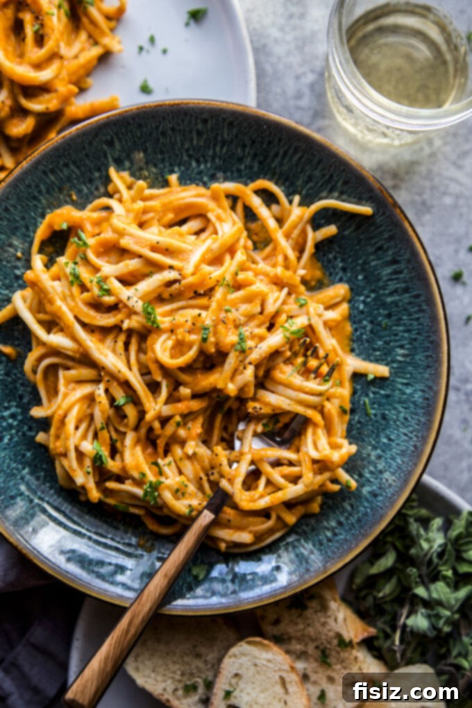 Smoky Chickpea Chipotle Pasta 3 Close-up of chickpea pasta in a rich chipotle sauce with fresh herbs