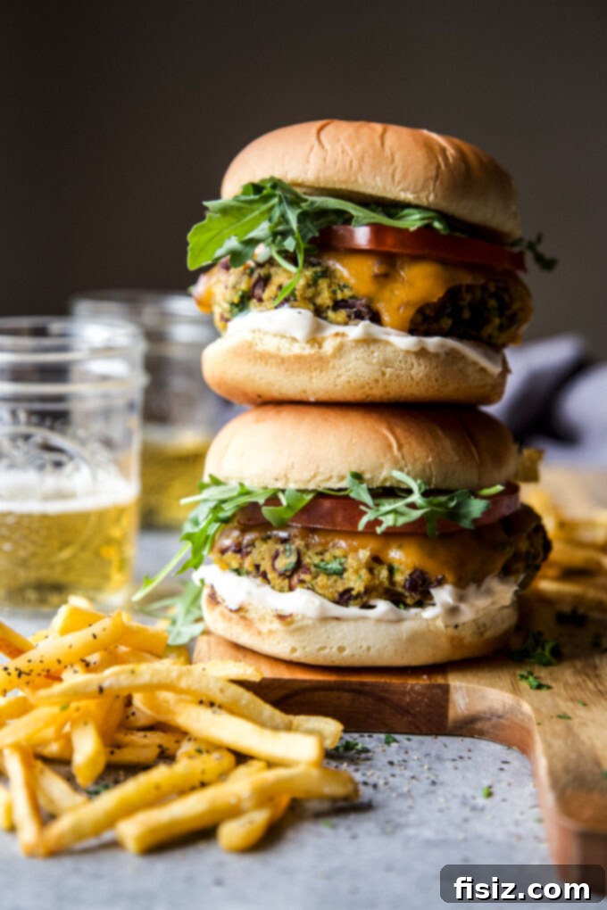 Aromatic Curry Plant-Based Burger 2 Homemade Curry Veggie Burger with fresh toppings on a wooden board
